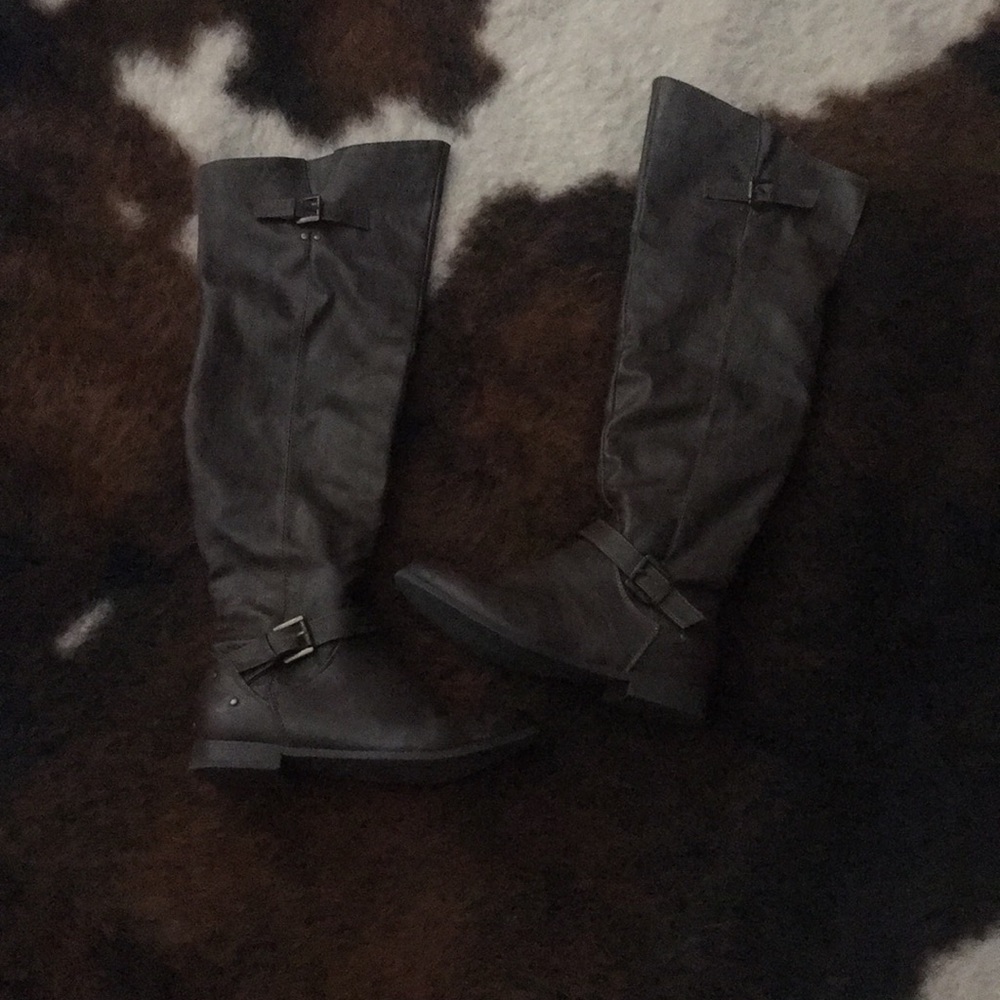 Over the knee brown boots.